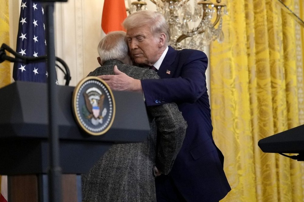FILE - President Donald Trump, right, hugs India's Prime Minister Narendra Modi during a news conference in the East Room of the White House, Feb. 13, 2025, in Washington. (AP Photo/Ben Curtis, File)