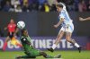 Yamila Rodriguez of Argentina shoots the ball past goalkeeper Andrea Moran of Ecuador during a Women's Copa America soccer match in Quito, Ecuador, Thursday, July 24, 2025. (AP Photo/Dolores Ochoa)