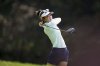 Grace Kim, of Australia, plays on the 4th hole during the last round of the Evian Championship women's golf tournament, in Evian, eastern France, Sunday, July 13, 2025. (AP Photo/Laurent Cipriani)