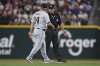 Detroit Tigers manager A.J. Hinch (14) and second base umpire Alfonso Márquez exchange words during the third inning of a baseball game against the Texas Rangers Friday, July 18, 2025, in Arlington, Texas. (AP Photo/Sam Hodde)