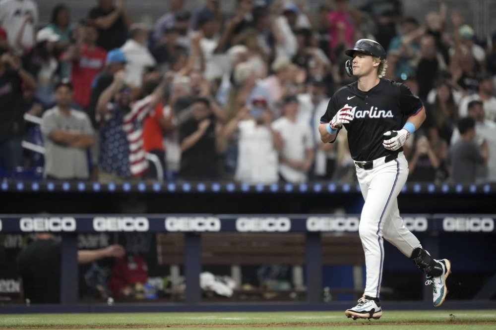 Miami Marlins' Kyle Stowers runs the bases after hitting a grand slam in the seventh inning of a baseball game against the New York Yankees, Friday, Aug. 1, 2025, in Miami. (AP Photo/Rebecca Blackwell)