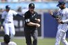 FILE - Umpire Dan Iassogna (58) calls out New York Yankees' Jasson Domínguez, left, at second base as Tampa Bay Rays shortstop José Caballero, right, reacts during the seventh inning of a baseball game, Sunday, April 20, 2025, in Tampa, Fla. (AP Photo/Phelan M. Ebenhack,File)