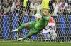 England goalkeeper Hannah Hampton stops a shot from Spain's Mariona Caldentey during a penalty shootout at the end of the Women's Euro 2025 final soccer match between England and Spain at St. Jakob-Park in Basel, Switzerland, Sunday, July 27, 2025. (AP Photo/Alessandra Tarantino)