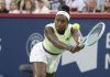 Coco Gauff of the United States hits a return to Victoria Mboko of Canada during round of 16 tennis action at the National Bank Open in Montreal, Saturday, Aug. 2, 2025. THE CANADIAN PRESS/Christinne Muschi