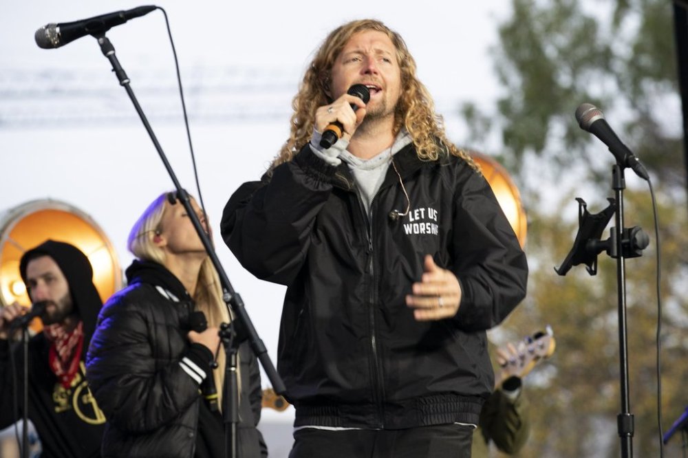 Christian musician Sean Feucht of California preaches to the crowd during a rally at the National Mall in Washington, Sunday, Oct. 25, 2020. (AP Photo/Jose Luis Magana)