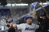 Miami Marlins' Heriberto Hernandez is doused with sunflower seeds after hitting a home run in the third inning of a baseball game against the Houston Astros, Wednesday, Aug. 6, 2025, in Miami. (AP Photo/Rebecca Blackwell)