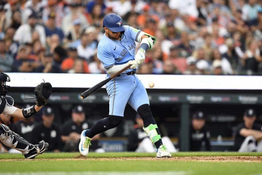 Toronto Blue Jays' Bo Bichette singles during the eighth inning of a baseball game against the Detroit Tigers, Saturday, July 26, 2025, in Detroit. (AP Photo/Jose Juarez)