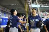 Seattle Mariners Jorge Polanco, right, is greeted by teammates as he holds a trident after hitting a home run during the eighth inning of a baseball game against the Los Angeles Angels Thursday, July 24, 2025, in Anaheim, Calif. (AP Photo/William Liang)