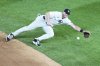 New York Yankees' DJ LeMahieu dives for a ball hit by Athletics' Nick Kurtz for a single during the fifth inning of a baseball game Friday, June 27, 2025, in New York. (AP Photo/Frank Franklin II)