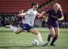 Ottawa Rapid's Delaney Baie Pridham, left, kicks the ball as Calgary Wild's Mijke Roelfsema closes in during second-half Northern Super League soccer action in Calgary, on Sunday, May 11, 2025.THE CANADIAN PRESS/Jeff McIntosh