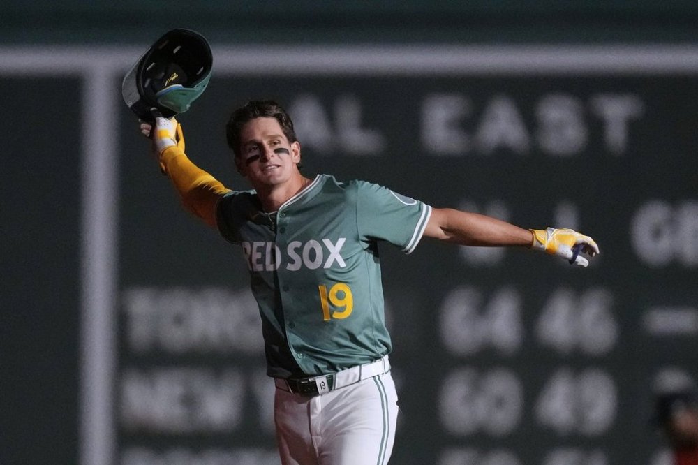 Boston Red Sox's Roman Anthony celebrates after his winning walkoff single in the 10th inning of a baseball game against the Houston Astros at Fenway Park, Friday, Aug. 1, 2025, in Boston. (AP Photo/Charles Krupa)