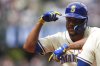 Seattle Mariners' Julio Rodriguez reacts after hitting a single against the Texas Rangers during the fifth inning of a baseball game Sunday, Aug. 3, 2025, in Seattle. (AP Photo/Lindsey Wasson)