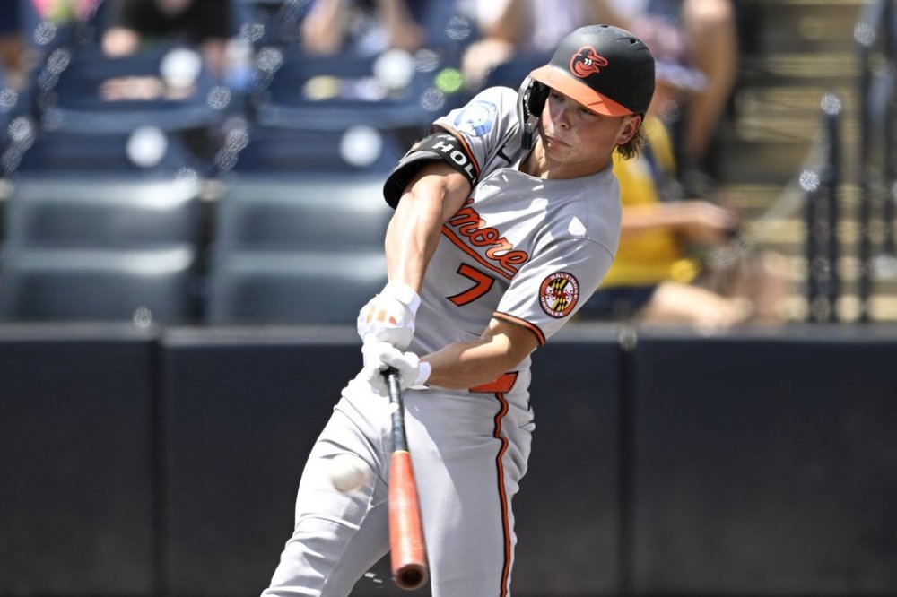 Baltimore Orioles' Jackson Holliday hits a solo home run during the first inning of a baseball game against the Tampa Bay Rays, Sunday, July 20, 2025, in Tampa, Fla. (AP Photo/Phelan M. Ebenhack)