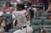 San Francisco Giants designated hitter Rafael Devers (16) hits a single against the Atlanta Braves in the first inning of a baseball game, Monday, July 21, 2025, in Atlanta. (AP Photo/Mike Stewart)