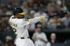 Athletics' Miguel Andujar hits an RBI double during the fifth inning of a baseball game against the Seattle Mariners Tuesday, July 29, 2025, in West Sacramento, Calif. (AP Photo/Sergio Estrada)