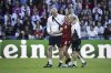 Denmark's Emma Snerle is helped out of the pitch after being knocked down by a ball to the face during the Euro 2025, group C, soccer match between Germany and Denmark at St. Jakob-Park in Basel, Switzerland, Tuesday, July 8, 2025. (Georgios Kefalas/Keystone via AP)
