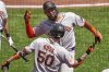 San Francisco Giants' Jerar Encarnacion, top, celebrates with Christian Koss (50) as he returns to the dugout after hitting a solo home run off Pittsburgh Pirates pitcher Andrew Heaney during the fifth inning of a baseball game in Pittsburgh, Wednesday, Aug. 6, 2025. (AP Photo/Gene J. Puskar)