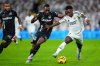 FILE - Leganes' Yan Diomande, center, and Real Madrid's Vinicius Junior fight for the ball during a Spanish La Liga soccer match between Real Madrid and Leganes at the Santiago Bernabeu stadium in Madrid, Spain, March 29, 2025. (AP Photo/Manu Fernandez, File)
