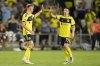 Nashville SC forward Sam Surridge, left, celebrates his goal with midfielder Alex Muyl (19) during the first half of an MLS soccer match against Toronto FC, Saturday, July 19, 2025, in Nashville, Tenn. (AP Photo/George Walker IV)