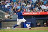 Toronto Blue Jays catcher Alejandro Kirk (30) throws his bat as he runs to first base during seventh inning MLB baseball action in Toronto, on Wednesday, July 2, 2025. THE CANADIAN PRESS/Sammy Kogan