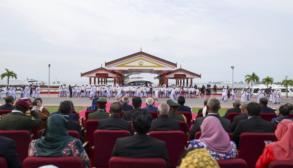 President of the Maldives Mohamed Muizzu, center left, with Indian Prime Minister Narendra Modi, center right seated in the front row, watch the 60th Independence Day parade at the republic square in Male, Maldives, Friday, July 25, 2025. (Indian Prime Ministers Office via AP)