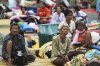 Thai residents who fled homes following clashes between Thai and Cambodian soldiers rest at an evacuation center in Surin province, Thailand, Friday, July 25, 2025. (AP Photo/Sakchai Lalit)