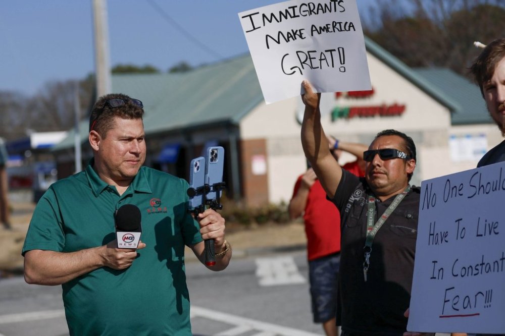 Mario Guevara, the metro Atlanta-based Spanish-language reporter, covers a protest against immigration enforcement on Buford Highway, Ga., on Saturday, Feb. 1, 2025. (Miguel Martinez/Atlanta Journal-Constitution via AP)