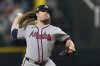 Atlanta Braves starting pitcher Grant Holmes throws to the Texas Rangers in the fourth inning of a baseball game Saturday, July 26, 2025, in Arlington, Texas. (AP Photo/Tony Gutierrez)
