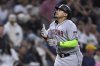 Arizona Diamondbacks' Josh Naylor celebrates while rounding the bases after hitting a two-run home run during the fifth inning of a baseball game against the San Diego Padres Monday, July 7, 2025, in San Diego. (AP Photo/Orlando Ramirez)