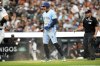 Toronto Blue Jays' George Springer, centre, reacts after scoring a run during the eighth inning of a baseball game against the Detroit Tigers, Saturday, July 26, 2025, in Detroit. (AP Photo/Jose Juarez)