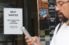 Help wanted sign is displayed at a live music and blues club in Chicago, Thursday, July 24, 2025. (AP Photo/Nam Y. Huh)