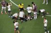 Chelsea's Moises Caicedo lies on the pitch receiving medical attention during the Club World Cup semifinal soccer match between Fluminense and Chelsea in East Rutherford, N.J., Tuesday, July 8, 2025. (AP Photo/Pamela Smith)