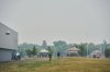 Wildfire evacuees are seen outside of the primary evacuation reception centre at the Leila Soccer Complex in Winnipeg, on Friday, July 11, 2025.  THE CANADIAN PRESS/David Lipnowski