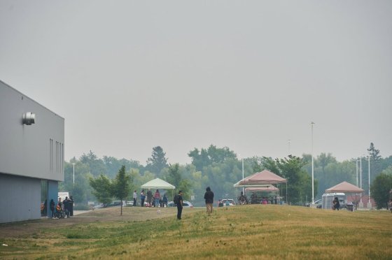 Wildfire evacuees outside of the primary evacuation reception centre at the Leila Soccer Complex in Winnipeg earlier this month. (David Lipnowski / The Canadian Press files)