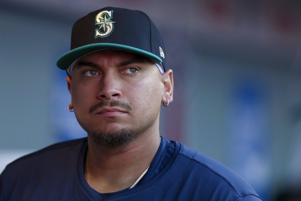 Seattle Mariners first baseman Josh Naylor stands in the dugout during the second inning of a baseball game against the Los Angeles Angels, Friday, July 25, 2025, in Anaheim, Calif. (AP Photo/Eric Thayer)