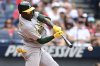 Athletics' Denzel Clarke hits a double during the eighth inning of a baseball game against the Cleveland Guardians, Sunday, July 20, 2025, in Cleveland. (AP Photo/David Dermer)