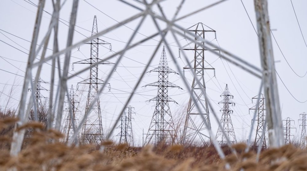 High voltage power lines are seen in Beauharnois, Que., on Monday, Jan. 27, 2025. The Beauharnois generating station on the St. Lawrence River consists of 36 turbines that supply power to Quebec, Ontario and New York state. THE CANADIAN PRESS/Christinne Muschi