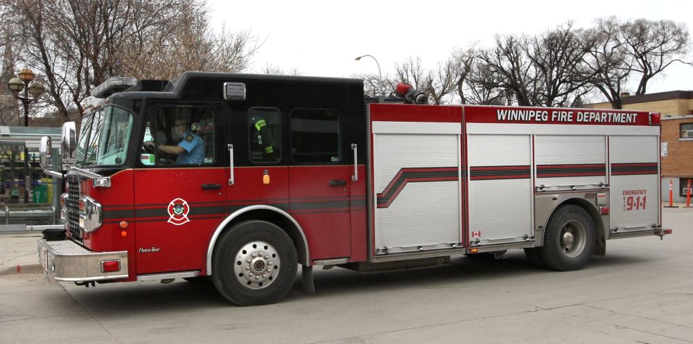 WAYNE GLOWACKI / FREE PRESS FILES
Winnipeg firefighters responded Friday to a pickup truck on fire north of the city's downtown. When the crew arrived on the scene, one firefighter was confronted by a man  with a metal pole and hit in the face, receiving minor injuries.
