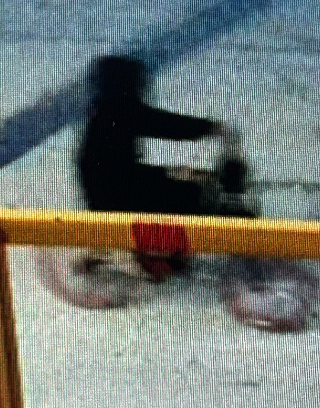 RCMP HANDOUT
Swan River RCMP released this photo of a suspect on a bike seen passing by the radio station just before the fire began. In the photo, the bike appears to have coloured rims, investigators said.