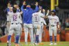 The New York Mets celebrate with the dugout after the team's win against the Detroit Tigers in a baseball game, Tuesday, Sept. 2, 2025, in Detroit. (AP Photo/Ryan Sun)