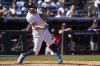 New York Yankees' Giancarlo Stanton hits a RBI single during the fifth inning of a baseball game against the Houston Astros, Saturday, Aug. 9, 2025, in New York. (AP Photo/Yuki Iwamura)