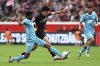 Leverkusen's Ibrahim Maza and Hoffenheim's Bernardo, left, fight for the ball during the German Bundesliga soccer match between Bayer Leverkusen and Hoffenheim at the BayArena in Leverkusen, Germany, Saturday Aug. 23, 2025. (Federico Gambarini/dpa via AP)