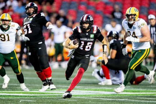 Redblacks quarterback Dustin Crum (18) runs with the ball during first-half CFL action against the Edmonton Elks in Ottawa on Friday, Aug. 22, 2025. THE CANADIAN PRESS/Spencer Colby