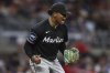 Miami Marlins pitcher Edward Cabrera reacts after completing eight innings of a baseball game against the Atlanta Braves, Friday, Aug. 8, 2025, in Atlanta. (AP Photo/Colin Hubbard)