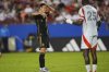 Los Angeles FC forward Heung Min Son, left, looks to FC Dallas defender Sebastien Ibeagha (25) during the second half of an MLS soccer match in Frisco, Texas, Saturday, Aug. 23, 2025. (AP Photo/LM Otero)