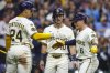 Milwaukee Brewers' Isaac Collins(10) reacts with William Contreras (24) after his three-run home run during the first inning of a baseball game against the Philadelphia Phillies, Wednesday, Sept. 3, 2025, in Milwaukee. (AP Photo/Jeffrey Phelps)