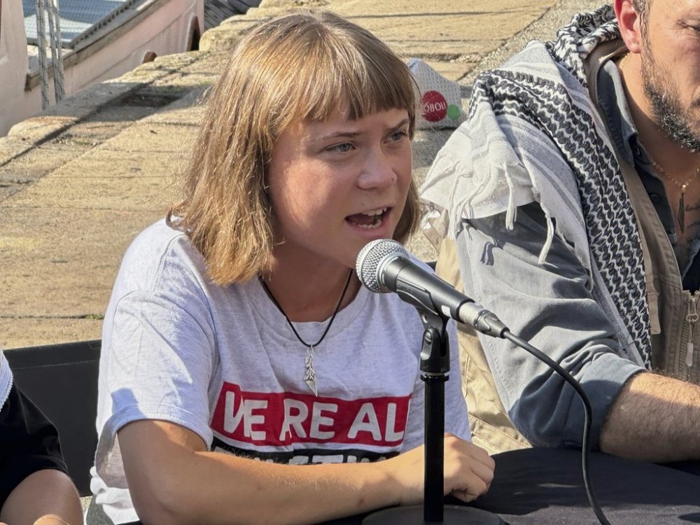 Swedish climate activist Greta Thunberg speaks during a news conference ahead of the launch of a civilian flotilla bound for Gaza, aiming to break the Israeli blockade and deliver humanitarian aid in Barcelona, Spain, Sunday, Aug. 31, 2025. (AP Photo/Hernan Munoz)
