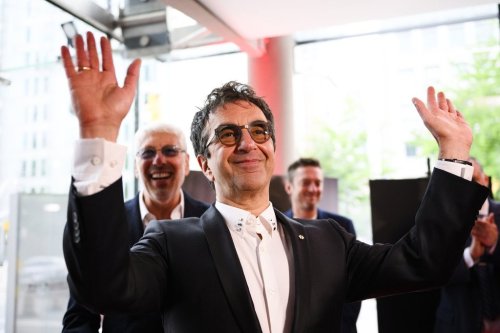 Director Atom Egoyan receives applause on the red carpet for the film 