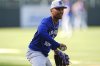 Los Angeles Dodgers shortstop Mookie Betts warms up before a baseball game against the Colorado Rockies Tuesday, Aug. 19, 2025, in Denver. (AP Photo/David Zalubowski)