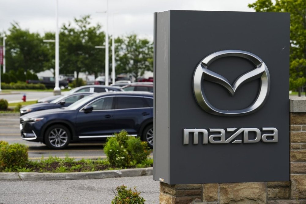 A Mazda vehicle logo is pictured at an automotive dealership in Ottawa on Friday, Aug. 11, 2023. THE CANADIAN PRESS/Sean Kilpatrick
